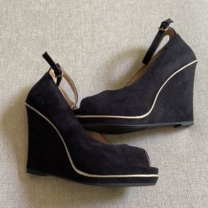 Black peep toe wedge with gold trim. Never worn!